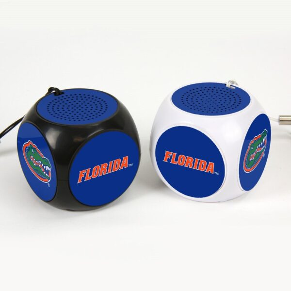 Two Florida Gators MX-100 Cubio Mini Bluetooth® Speaker Plus Selfie Remote, one black and one white, with team logos, on a plain background.