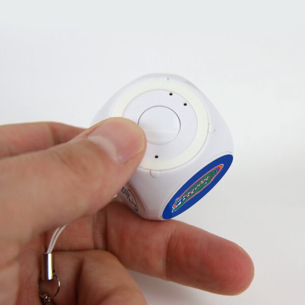 A hand pressing a button on a Florida Gators MX-100 Cubio Mini Bluetooth® Speaker Plus Selfie Remote with a colorful label and a keychain attached.