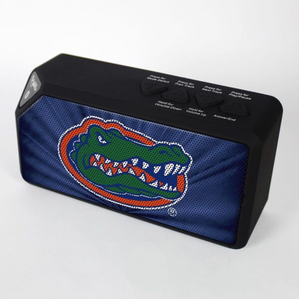 Florida Gators BX-100 Bluetooth Speaker with a vibrant blue fabric cover featuring a colorful embroidered alligator design, set against a plain white background.