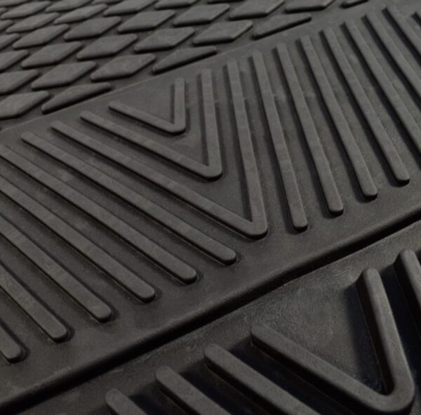 Close-up of a Miami Hurricanes 4PC Vinyl Car Mats with interlocking chevron and linear patterns.