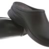 A pair of black, slip-on chef shoes isolated on a white background.