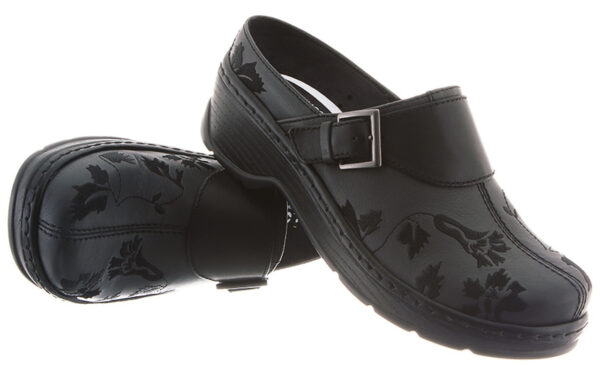 A pair of black, floral-patterned clogs with a buckle strap over the top, photographed against a white background.