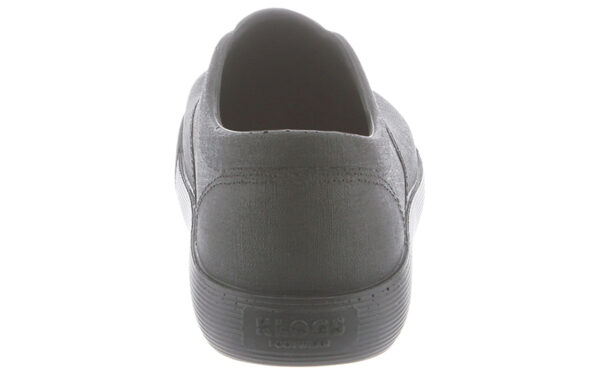 Rear view of a gray keds sneaker showing the textured sole and a small logo on the heel.