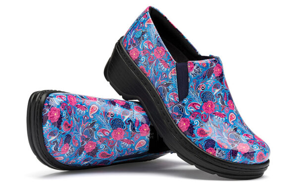 A pair of floral print clogs with vibrant blue and pink patterns on a white background.