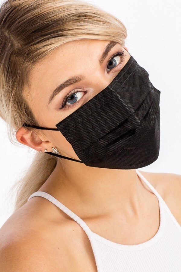 Young woman wearing a BLACK DISPOSABLE SURGICAL FACE MASK - 50 PACK and a white tank top, looking directly at the camera.