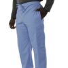 A person wearing a grey sweatshirt and light blue UltraSoft Unisex Cargo 6-Pocket Pants 313C with a drawstring, standing with one hand in a pocket.