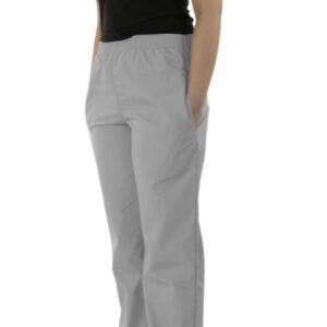 A woman standing in profile wearing a black t-shirt, UltraSoft Unisex Classic Elastic Waist Scrub Pants 300C, and white sneakers, isolated on a white background.