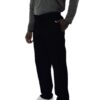 Man wearing a gray long-sleeve shirt and UltraSoft Unisex Cargo 6-Pocket Pants 313C with white sneakers, standing with one hand in his pocket, isolated on a white background.