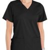 A woman wearing a black Comfort Utility V-Neck Top with short sleeves and two front pockets.