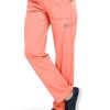 A person wearing bright orange Flat Front Straight Leg Pant C52106 and black sneakers, with a partial view of a white top. Only the lower half of the body is shown.