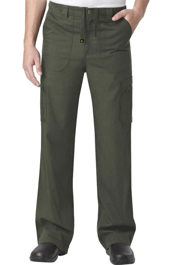 Man wearing olive green cargo pants with pockets, standing with hands partially inserted in front pockets.