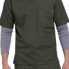 Man wearing a SOLID RIPSTOP SCRUB UTILITY TOP (Men's C15108) in dark green with a layered gray shirt underneath, standing with arms at his sides.