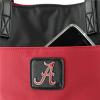 A smartphone protruding from a Phyllis Handbag 9176 ALABAMA with a black patch featuring a white 'a' logo.