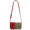 A red and beige Navajo 8588 ALABAMA crossbody bag with a prominent logo pattern and an adjustable strap.
