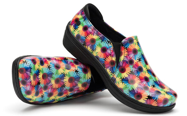 A pair of Moxy by Klogs Footwear slip-on shoes with a colorful floral print on a white background.