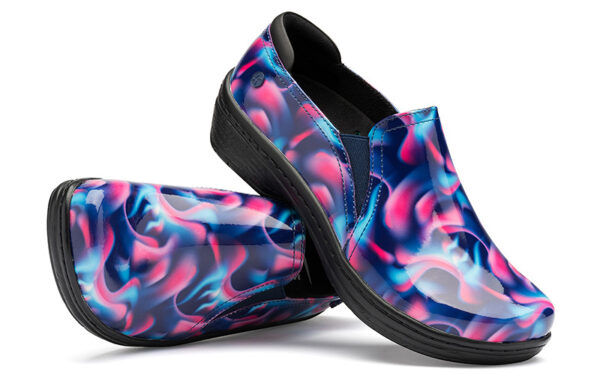 A pair of slip-on shoes with a colorful, abstract blue and pink design on a white background.