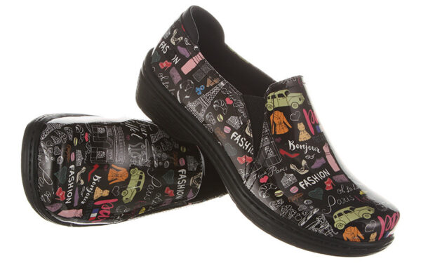A pair of Moxy by Klogs Footwear slip-on shoes with colorful fashion-themed graphics and text designs.