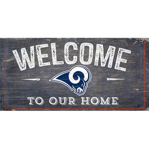 A worn wooden sign reading "welcome to our home" with the LA Rams Football and My Dog Sign logo on the left side.