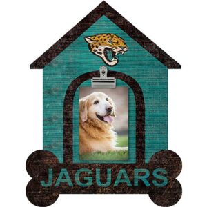 Decorative house-shaped sign featuring "Jacksonville Jaguars" text, a golden retriever photo in the center, and a leopard head emblem on top.