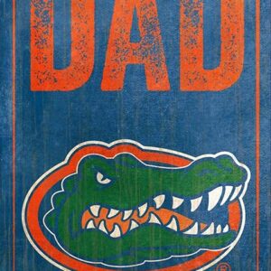 A University of Florida Best Dad Sign featuring the words "best dad" in orange text above the logo of a green alligator in an oval, all set against a blue distressed background.