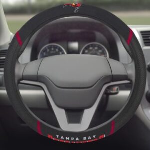 Sentence with product name: NFL - Tampa Bay Buccaneers Steering Wheel Cover, viewed from driver's seat perspective, with dashboard in the background.