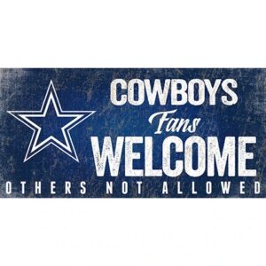 Faded sign with the text "cowboys fans welcome, others not allowed" and a large star, suggesting exclusive support for fans of the dallas cowboys.