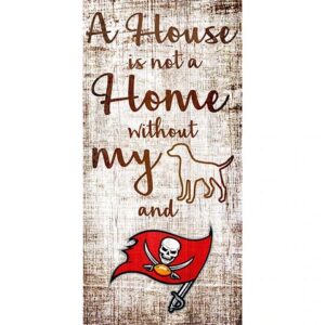 Decorative sign with text "a house is not a home without my" followed by illustrations of a dog and a tampa bay buccaneers flag.