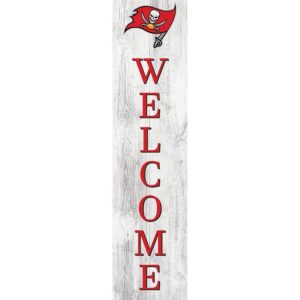 A vertical "welcome" sign on a wooden background with a red pirate flag featuring a skull and crossbones at the top.