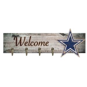 Rustic wooden "welcome" sign featuring three metal hooks and a blue star decoration on the right side.