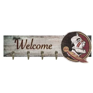Rustic wooden "welcome" sign featuring a native american chief logo and three metal hooks.