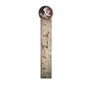 Vintage-style wooden growth chart with a whimsical top ornament depicting a cartoon-style pirate head.