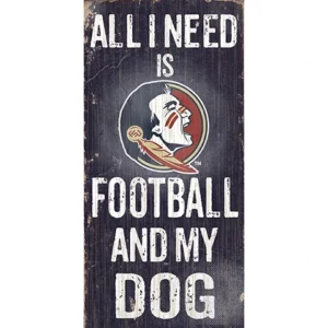 A vertical sign with the text "all i need is football and my dog," featuring a stylized football logo with a dog mascot on a distressed wood background.