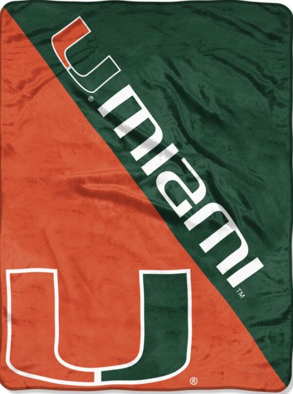 A Miami Hurricanes Blanket 46x60 Micro Raschel Halftone Design Rolled featuring a large orange and green diagonal stripe with the letter "u" logo at the bottom and the word "miami" across the stripe.