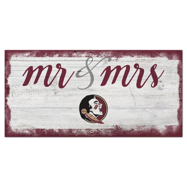 Decorative sign featuring the words "mr & mrs" in cursive script on a distressed white wooden background with a circular logo depicting a native american man.