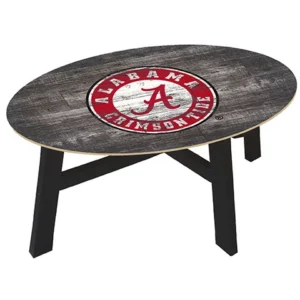 Oval coffee table featuring a distressed finish and the alabama crimson tide logo at the center, supported by black legs.