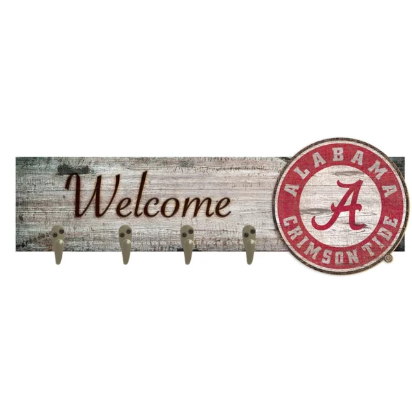 A rustic wooden "welcome" sign featuring the university of alabama crimson tide logo with four metal hooks.