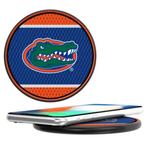 A round, pop-up FLORIDA GATORS MESH 10-WATT WIRELESS CHARGER featuring the university of florida gators logo, shown both closed and expanded beside a smartphone.