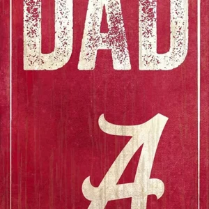 Vintage-style red sign with the text "best dad a" in white, featuring distressed and faded typography, conveying a retro aesthetic.