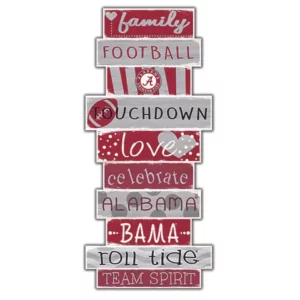Wall decor with stacked signs featuring phrases like "family," "football," "touchdown," "love," and "alabama" in a sports theme with a university of alabama logo.