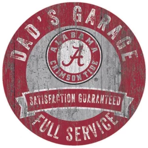 Circular sign with distressed style featuring the text "dad's garage," an alabama crimson tide logo, and the phrases "satisfaction guaranteed" and "full service.