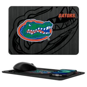 FLORIDA GATORS TILT 15-WATT WIRELESS CHARGER AND MOUSE PAD featuring the university of florida gators logo with a vibrant alligator graphic, accompanied by a wireless mouse and smartphone resting on it.