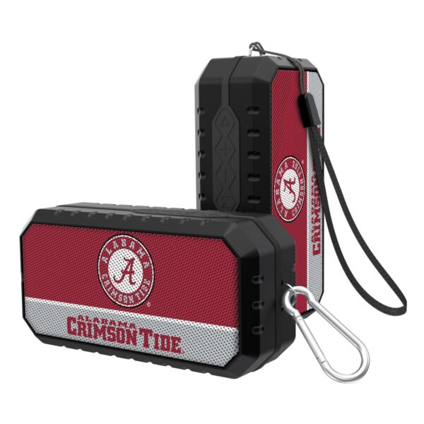 Two Alabama Crimson-Tide SOLID WORDMARK Bluetooth speakers, one upright and one lying down, with a black, red, and gray design.