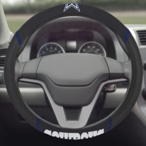 A close-up view of a Dallas Cowboys steering wheel cover with logo, featuring carbon fiber detailing and a digital dashboard visible through the wheel.