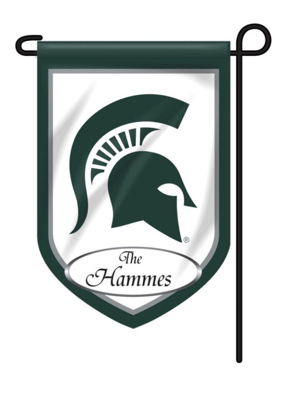 A green and white Personalized Collegiate Garden Flag featuring a spartan helmet logo with the text "the hammes" below it, displayed on a flagpole.