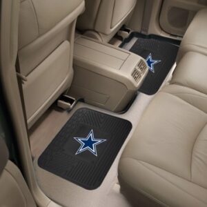 Interior of a vehicle showing beige seats and floor mats with a Dallas Cowboys Utility Mat Set with star logo on them.